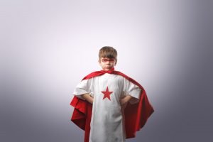 child dressed as superhero